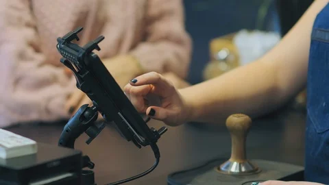 Waiter uses technology for taking order and taps on screen Stock Footage 125473435