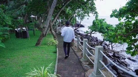 Waiter walking donw the path 3 Stock Footage 287968720