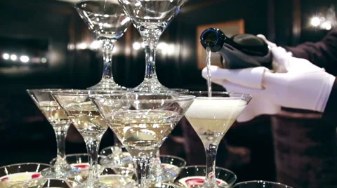 The Waiter in white gloves at the Champagne Glass Tower background Stock Footage 68870383