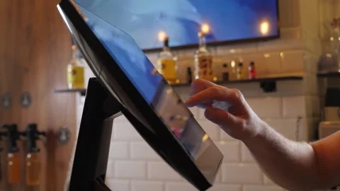 The waiter works in a cafe, forms the customers order using the touch screen. Stock Footage 344038368