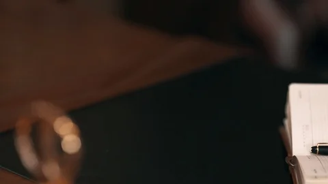 The waiter's hand puts a cup of coffee on the table Video stock 99560554