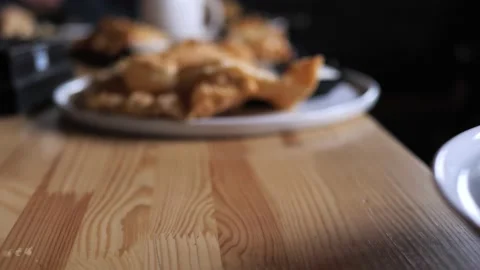 The waiter's hand puts on the table a plate with a dietary salad, proper Stock Footage 203600224