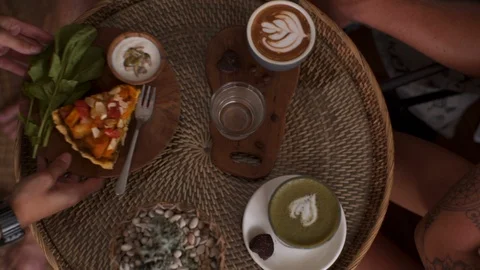 Waiter's hands put on the table with coffee Pumpkin vegetable pie Video stock 101649467