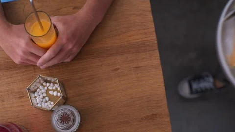 Waiter's hands put on the table waffles with cream and strawberries Video stock 101634811