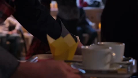 Waiter's hands with a tray in low light. Staff clears the table after clients. Stock Footage 191746291