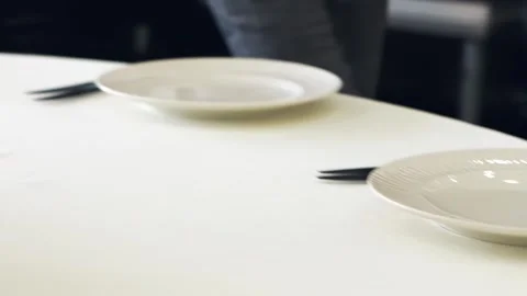 Waiters lay out cutlery on the table, preparing for the wedding banquet Stock Footage 260880202