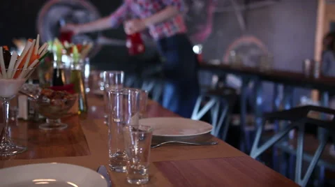 Waiters laying the table in a restaurant Stock Footage 64923013