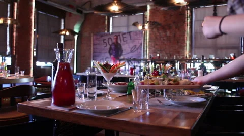 Waiters laying the table in a restaurant Stock Footage 64932344