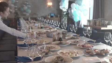 The waiters set the festive tables. goblets and snacks Stock Footage 123541030