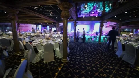 Waiters work among served tables in hall of Golden Palace during Award Records Stock Footage 276371991
