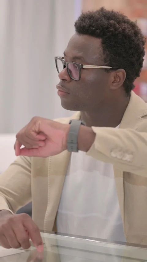 Waiting African American Man Checking Time on Wrist Watch, vertical video Stock Footage 328566061