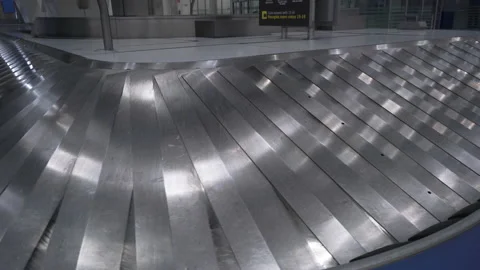 Waiting for baggage after the arrival of a passenger plane. Empty hall terminal Stock Footage 133077904