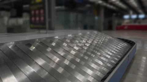 Waiting for baggage after the arrival of a passenger plane. Empty hall terminal Stock Footage 133078302
