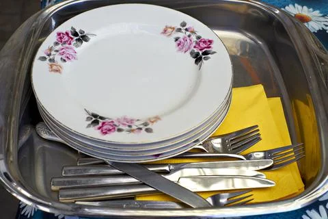 Waiting to be needed to use. Selective focus on plates and cutleries. Close up Stock Photos