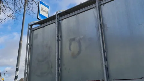 Waiting for the bus. Bus stop in the close-up Stock Footage 153661957