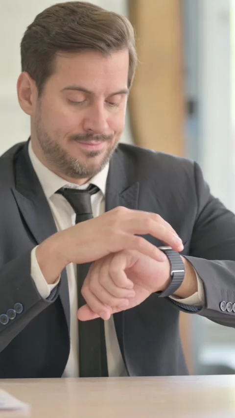 Waiting Businessman Checking Time on Wrist Watch at Work, vertical video Stock Footage 328556164
