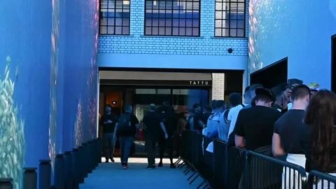 Waiting to get into HERE at Outernet outside Tattu, London, United Kingdom Stock Footage 213799799