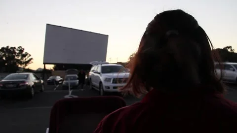 Waiting for it to get dark enough for the movie Stock Footage 150395728
