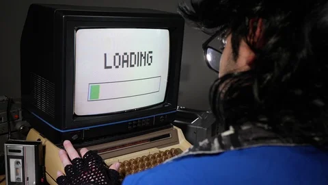 Waiting Looking at a Loading Screen on a Retro Computer 70s 80s Stock Footage 126466664