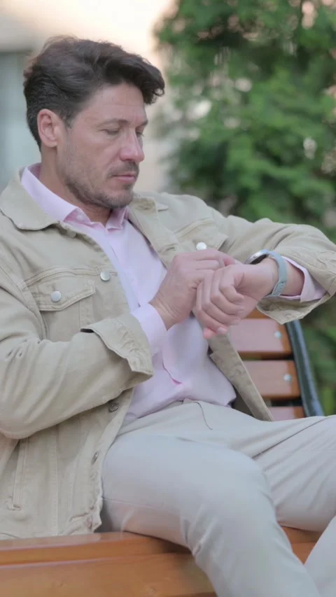 Waiting Man Checking Time on Watch Outdoor, vertical Stock Footage 326266854