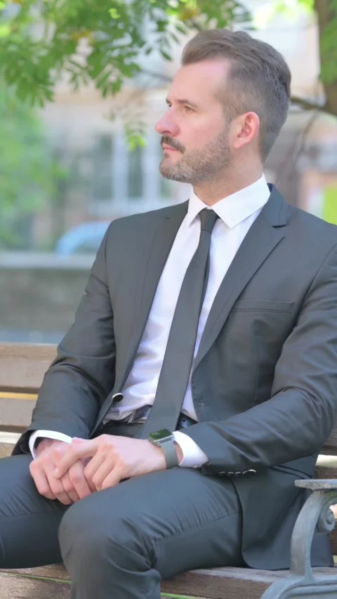 Waiting Middle Aged Businessman Checking Time Sitting Outdoor on Bench, Vertical Video stock 319042963
