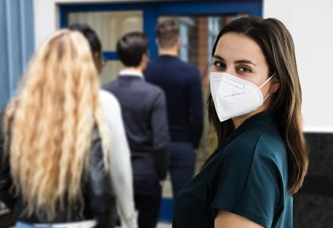 Waiting In Queue Wearing Mask Stock Photos