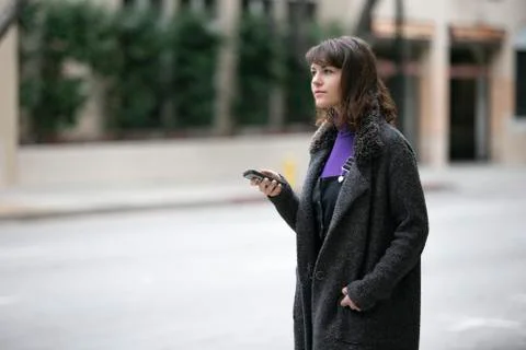 Waiting for a Rideshare or Checking Mobile Phone for GPS Navigation Stock Photos