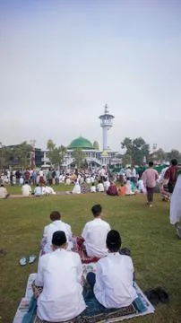 Waiting for the sermon in front of the mosque for Eid prayer. Stock Photos