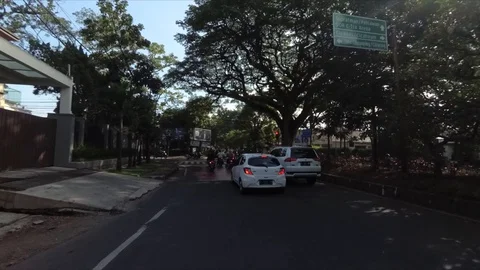 Waiting at Traffic Light Taman Pramuka,(Bengawan Intersection) by Car Stock Footage 129708853