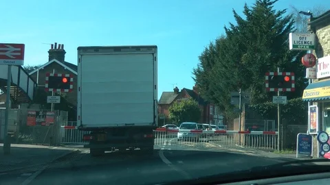 Waiting for a train at a level crossing Stock Footage 91698864