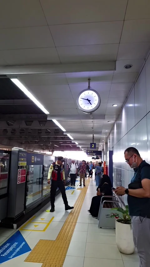 Waiting for the train. LRT Commuter Scene. LRT Station Platform Stock Footage 327656054