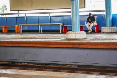 Waiting at the train station Stock Photos