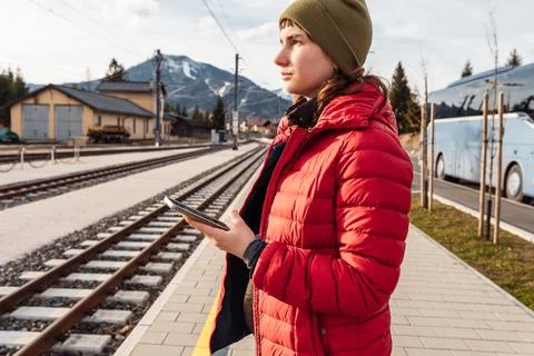 Waiting for train at train station in Alps Stockfoto's
