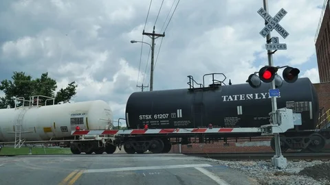Waiting for a train at train tracks crossroads Видео 76452539