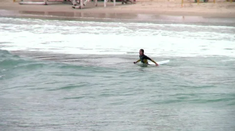 Waiting for the waves - surfers 4 Stock Footage 692566