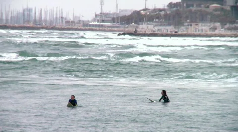 Waiting for the waves - surfers 5 Stock Footage 693034