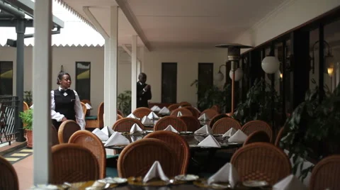 Waitress and manager preparing restaurant tables, Nairobi, Kenya, Africa Stock Footage 52084462