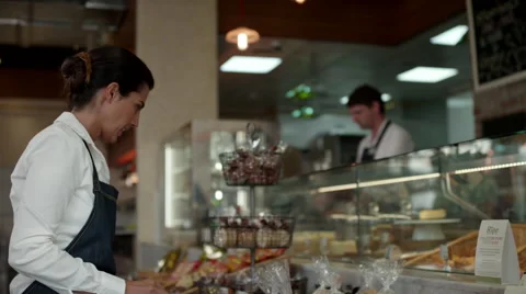Waitress arranging food packets at cafe. Stock Footage 64097304