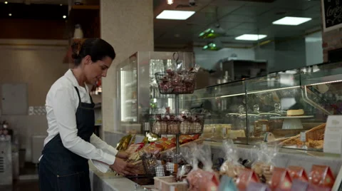 Waitress arranging food packets at cafe. Stock Footage 64097665