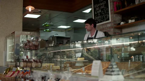 Waitress arranging food packets at cafe. Stock Footage 64098218