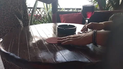 The waitress brought the ordered drinks and put them on the table Vídeos de archivo 308304523