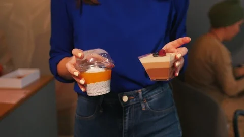 Waitress is carring desserts to the table Stock Footage 118529646