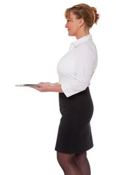 Waitress holding an empty silver tray Stock Photos