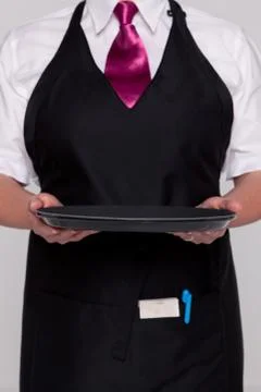 Waitress holding an empty tray Stock Photos