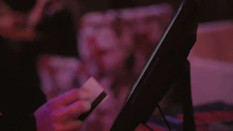 The waitress makes an order for the kitchen using a touch computer or POS system Stock Footage 98121399