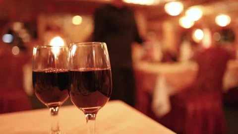 Waitress Passing Wine Glasses in Elegant Restaurant Stock Footage 313787489