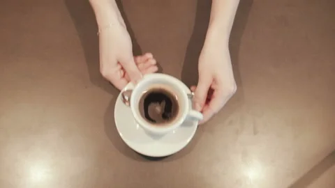 Waitress placing a coffee on the counter top view Stock Footage 100533975