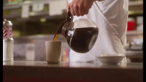 Waitress Pouring Coffee in a Diner Stock Footage 301276256
