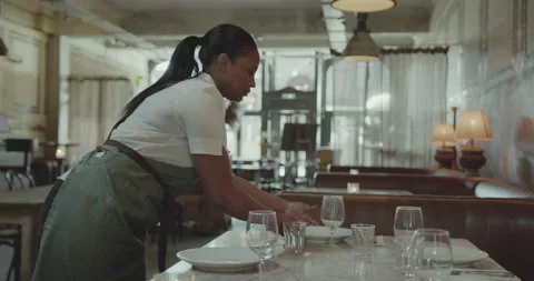 Waitress  Preparing for Service, laying table in a Restaurant Video stock 221956524