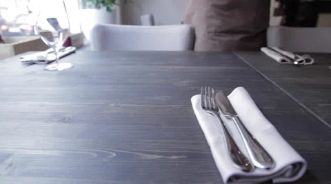 The waitress puts the glass on the table Видео 58856185